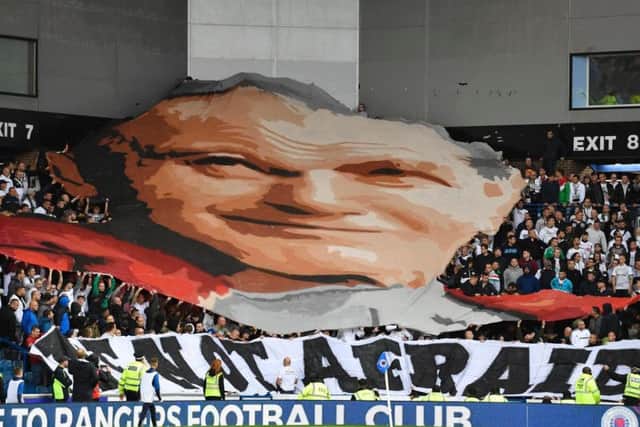 Legia fans unveil a banner commemorating Pope John Paul II
