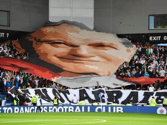 Legia fans unveil a banner commemorating Pope John Paul II