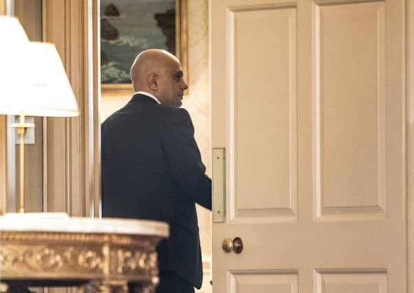 Sajid Javid is seen through the door of 11 Downing Street. Picture: Stefan Rousseau/PA