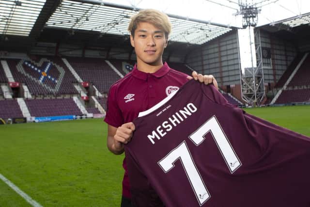 New Hearts loan signing Ryotaro Meshino shows off his new jersey at Tynecastle. Picture: Bruce White/SNS Group