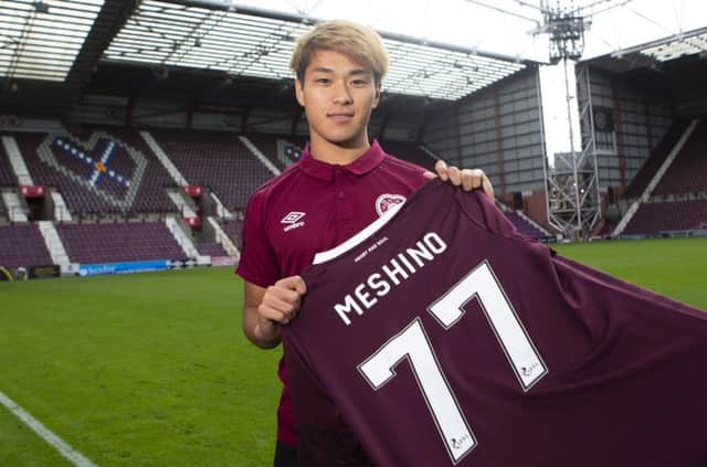 New Hearts loan signing Ryotaro Meshino shows off his new jersey at Tynecastle. Picture: Bruce White/SNS Group