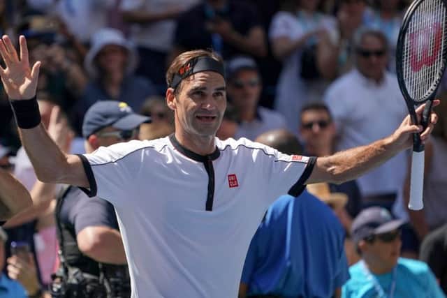 Roger Federer enjoys his moment of victory yesterday but later raged at suggestions he had a hand in the timing of his match. Picture: AFP/Getty