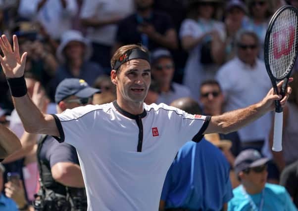 Roger Federer enjoys his moment of victory yesterday but later raged at suggestions he had a hand in the timing of his match. Picture: AFP/Getty
