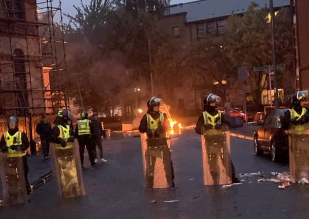Riot police at the scene in Govan on Friday night