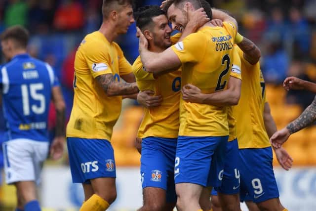 Stephen O'Donnell is congratulated by teammates.