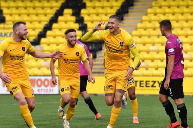 Lyndon Dykes celebrates his goal against St Mirren.