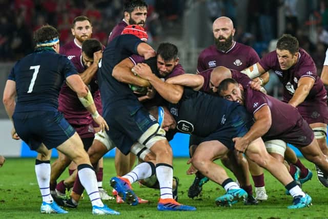 Scotland's flanker Hamish Watson (7)) looks on as players fight for the ball in a ruck. Picture: Vano Shlamov / AFP)VANO SHLAMOV/AFP/Getty Images