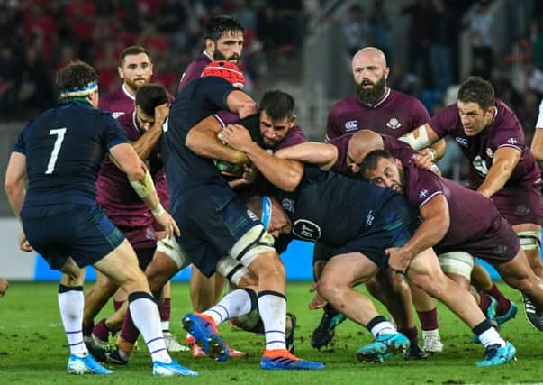 Scotland's flanker Hamish Watson (7)) looks on as players fight for the ball in a ruck. Picture: Vano Shlamov / AFP)VANO SHLAMOV/AFP/Getty Images