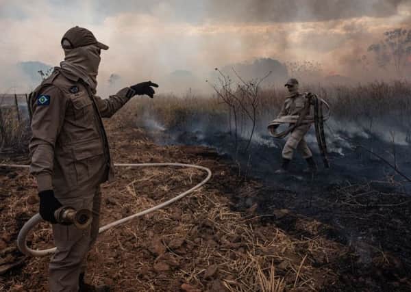 Firefighter combats a fire in the Amazon basin in the municipality Sorriso, Mato Grosso State, Brazil, on August 26, 2019. Picture: Mayke TOSCANO / Mato Grosso State Communication Department / AFP