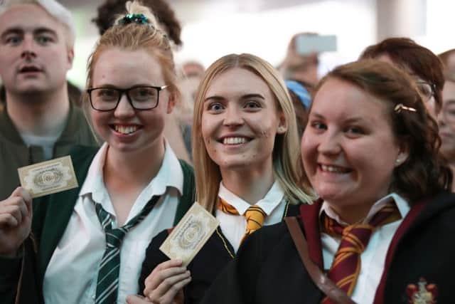 Harry Potter fans gathered to watch as the Hogwarts Express appears on the departure board. Picture: Chris Radburn/PA Wire