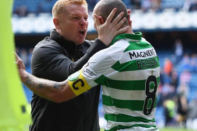 Celtic manager Neil Lennon celebrates his sides 2-0 victory at Ibrox with captain Scott Brown, whom he claimed had been written off before the match. Picture: Craig Williamson/SNS