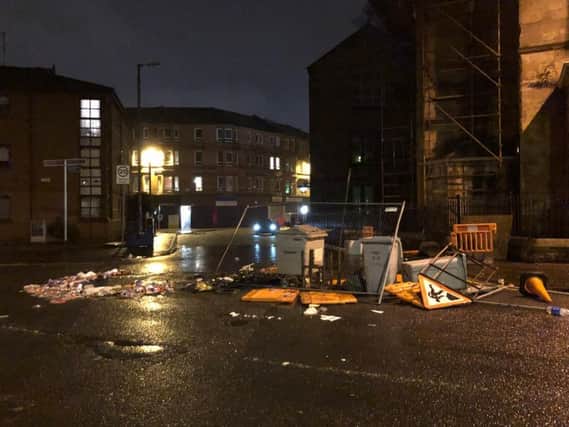 The scene in Govan Road after trouble flared following a Irish Unity march and counter protest. Picture: PA