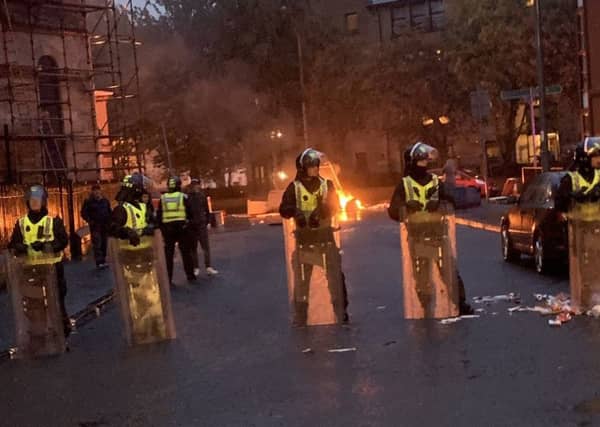 Riot police deployed on the streets of Glasgow last Friday. Picture: PA