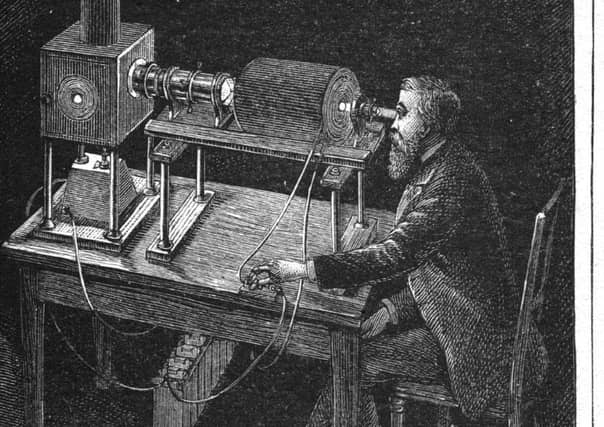 A scientist, possibly James Clerk Maxwell, sits at a machine and investigates 'Magnetism, Light, and Molecular Spinning Tops' in around 1860. (Picture: Hulton Archive/Getty Images)