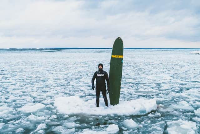 Midwinter surfing on Lake Michigan presents some novel hazards. Schetter says that when it gets really cold he sometimes has to contend with "ice chunks falling on my head."