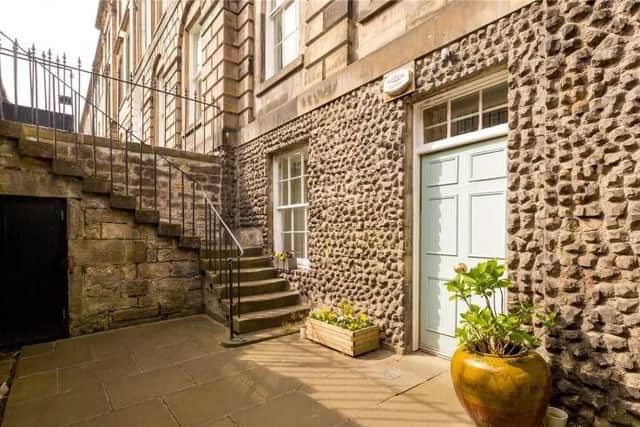 The flat is ground and garden level of an A listed Georgian townhouse.