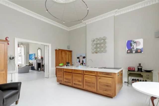 The spacious kitchen has dining and sitting areas.