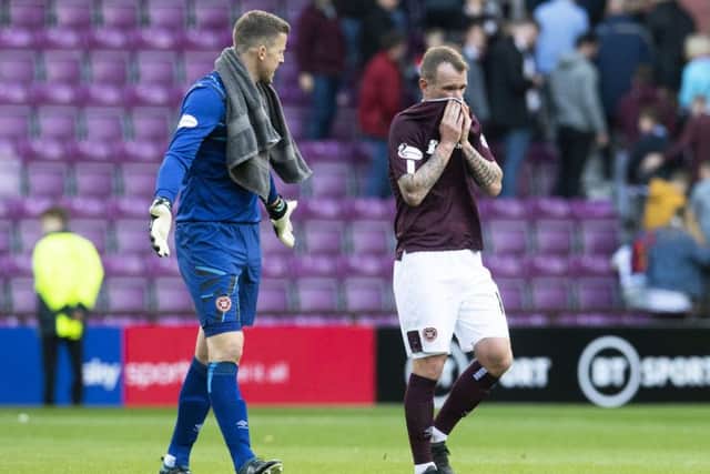 Colin Doyle, left, and Glenn Whelan begin the post mortem at the final whistle, following Hearts defensive disasters last Saturday. Picture: SNS.