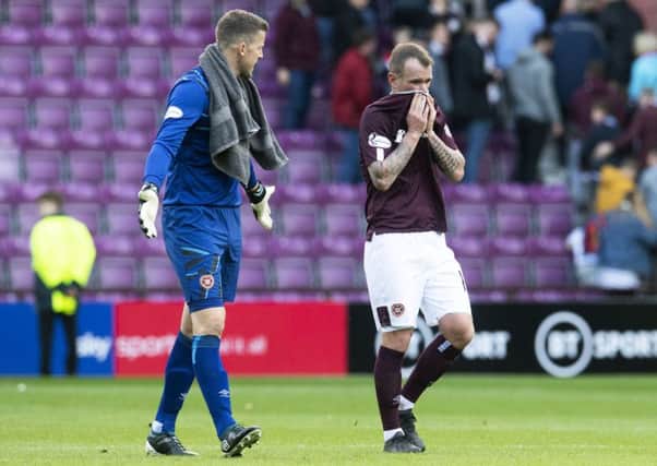 Colin Doyle, left, and Glenn Whelan begin the post mortem at the final whistle, following Hearts defensive disasters last Saturday. Picture: SNS.