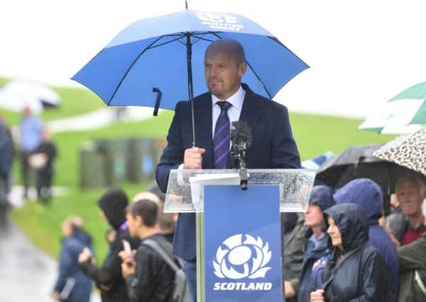 Gregor Townsend shields himself from the rain as he announces his World Cup squad at Linlithgow Palace. Picture: Gary Hutchison/SNS