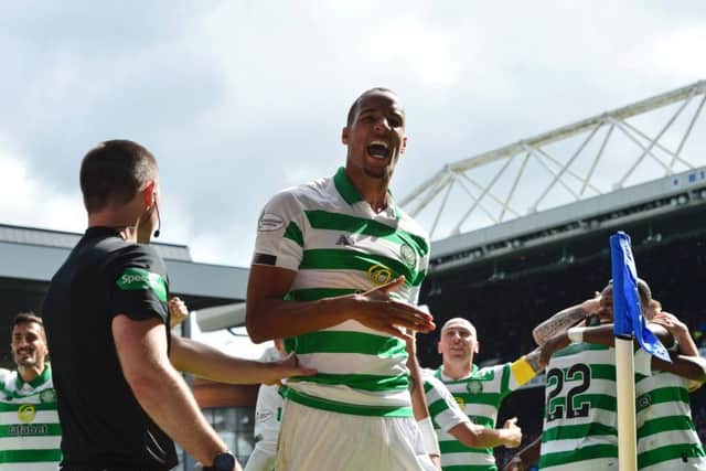 Christopher Jullien celebrates with his Celtic team-mates after Jonny Hayes second goal against Rangers at Ibrox last Sunday. Picture: Mark Runnacles/Getty