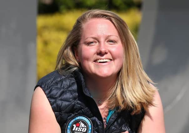 Mollie Hughes, 26, arrives at Edinburgh Airport after becoming the world's youngest woman to climb Mount Everest from both sides.