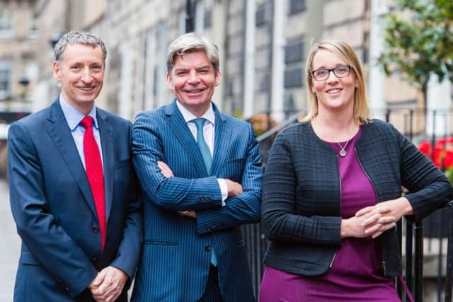 From left: Johnston Financial's Adrian Johnston, John McArdle and Suzanne Gray. Picture: Ian Georgeson