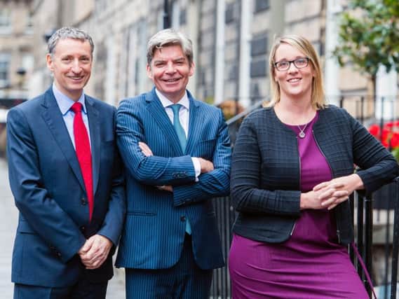 From left: Johnston Financial's Adrian Johnston, John McArdle and Suzanne Gray. Picture: Ian Georgeson