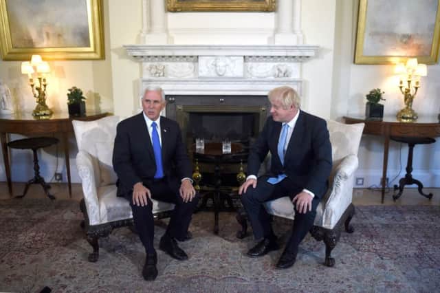 Britain's Prime Minister Boris Johnson (R) holds a meeting with US Vice-President Mike Pence (L) inside 10 Downing Street. (Photo by Peter SUMMERS / POOL / AFP)PETER SUMMERS/AFP/Getty Images