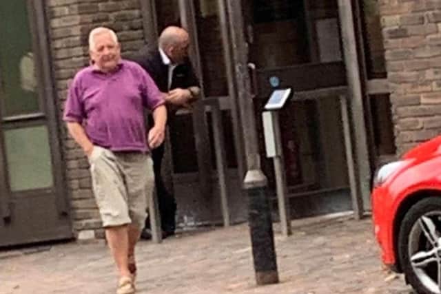 Michael Feeney, 67, leaving court after pleading guilty to two charges. Picture: SWNS