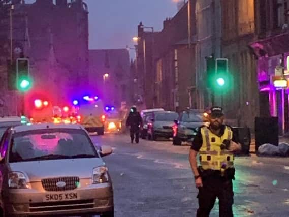 Officers were spat on and had human waste thrown at them during last Friday's riot, according to Police Scotland's chaplain.