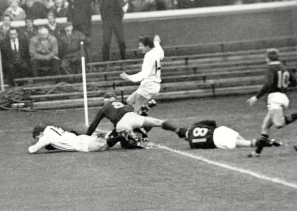 Ian Smith , in white, dives over thee line to score a try against South Africa on his debut for Scotland in 1969. Picture: Colorsport/Shutterstock