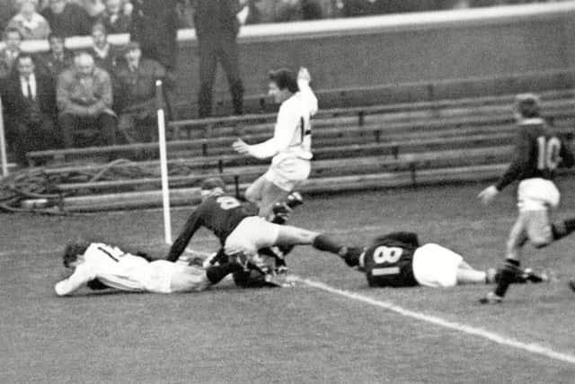 Ian Smith , in white, dives over thee line to score a try against South Africa on his debut for Scotland in 1969. Picture: Colorsport/Shutterstock
