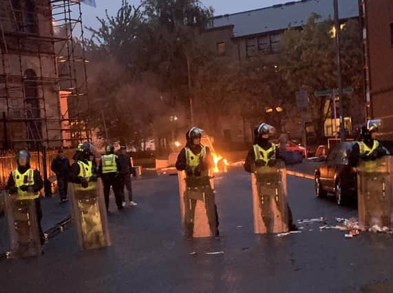 Picture taken with permission from the twitter feed of @JohnAitken90 of Govan Road, Glasgow blocked by police as trouble flared following a Irish Unity march and counter protest. Picture: PA