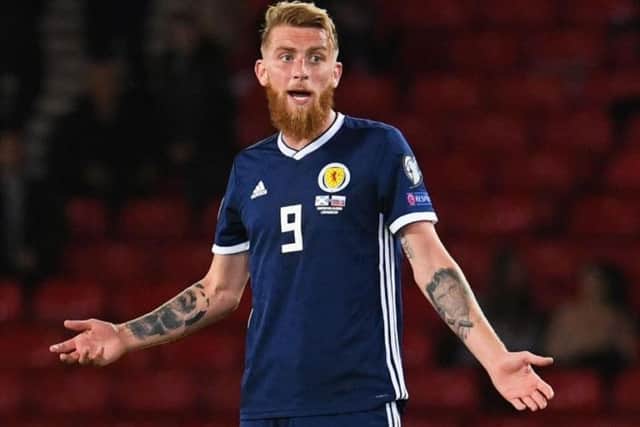 Oli McBurnie reacts during the 2-1 defeat to Russia at Hampden