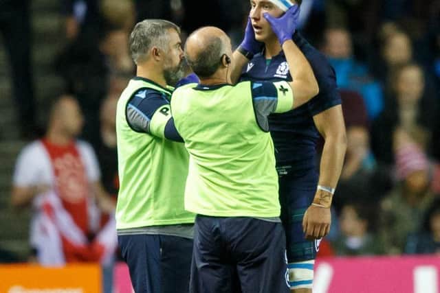 Jamie Richie is treated for a facial injury. Picture: Robert Perry/Getty Images