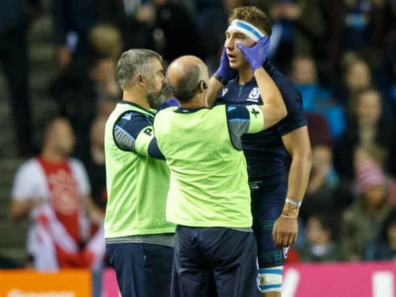 Jamie Richie is treated for a facial injury. Picture: Robert Perry/Getty Images