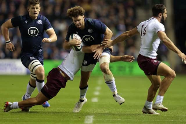 Georgia's Soso Matiashvili tries to hang on to Scotland's Duncan Taylor during the World Cup warm-up match at BT Murrayfield. Picture: Graham Stuart/PA