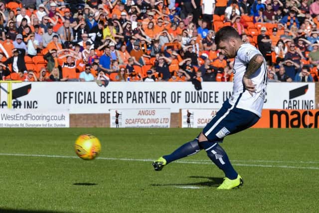 Arbroath's Bobby Linn scores the winning penalty against Dundee United. Picture: Rob Casey/SNS