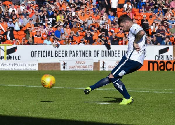 Arbroath's Bobby Linn scores the winning penalty against Dundee United. Picture: Rob Casey/SNS