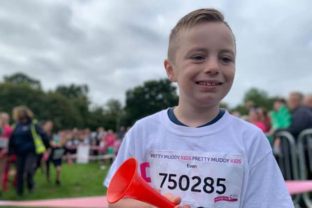 Evan Wilson, seven, was chosen as VIP starter for Race for Life Pretty Muddy Glasgow, a 5K mud-splattered obstacle course for Cancer Research UK.