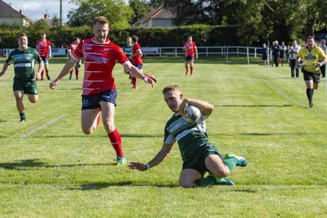 Hawick winger Logan Gordon-Wooley scores one of his two tries in his teams win away to Musselburgh on Saturday. Picture: SNS/SRU.