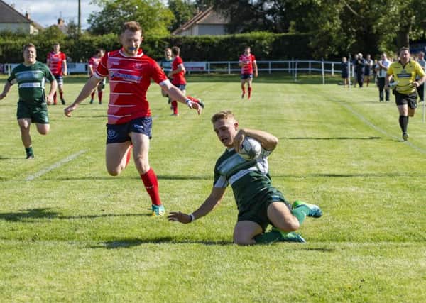Hawick winger Logan Gordon-Wooley scores one of his two tries in his teams win away to Musselburgh on Saturday. Picture: SNS/SRU.