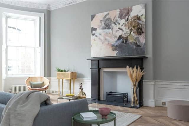 The marble fireplace has a slate hearth and bio-ethanol fire insert.