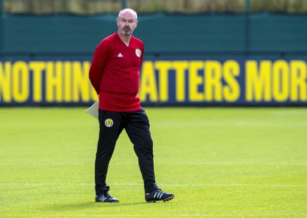Steve Clarke oversees a training session at Oriam yesterday as his Scotland team prepare to face Belgium. Picture: SNS.