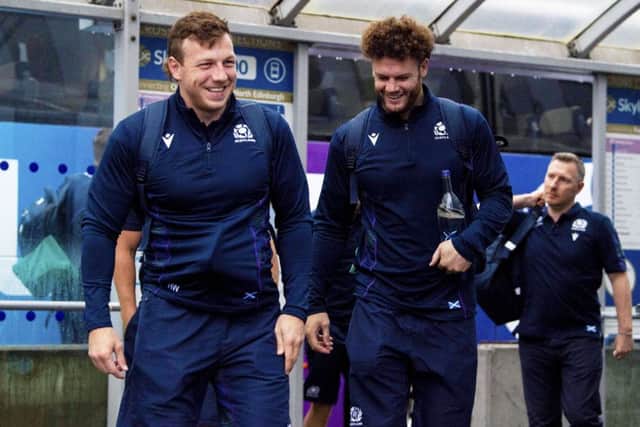 Hamish Watson, left, and Duncan Taylor share a joke as they prepare for departure from Edinburgh Airport yesterday. Picture: SNS