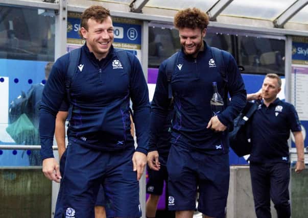 Hamish Watson, left, and Duncan Taylor share a joke as they prepare for departure from Edinburgh Airport yesterday. Picture: SNS
