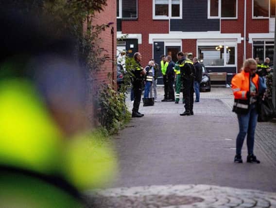 Police officers investigate a house after a shooting in which three people died ion Dordrecht, Netherlands. (Niels Wenstedt / ANO / AFP)
