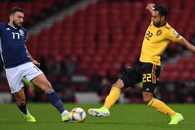 Scotland's Robert Snodgrass challenges Belgium's Nacer Chadli at a half-empty Hampden Park. Picture: Andy Buchanan / AFP