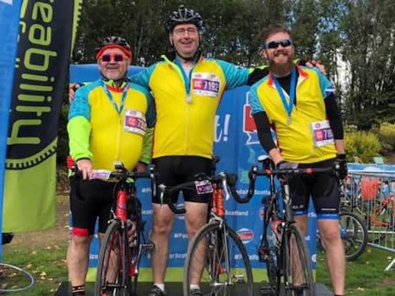 Glasgow father-of-two Colin Anderson (centre) was cycling with best friend Ian Laidlaw and son Fraser as part of a team when he collapsed during the charity Pedal for Scotland event on Sunday